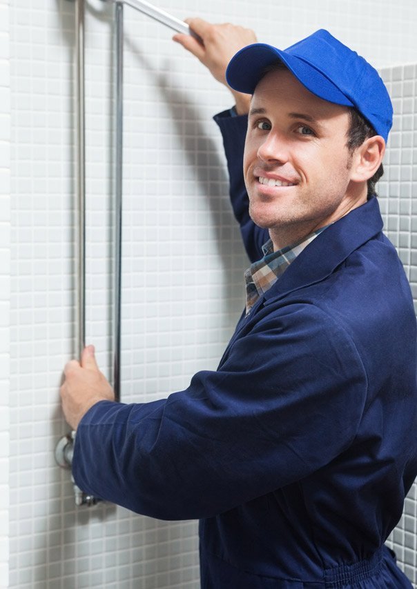 robinson-plumbing-plumber-fixing-a-shower-604x854